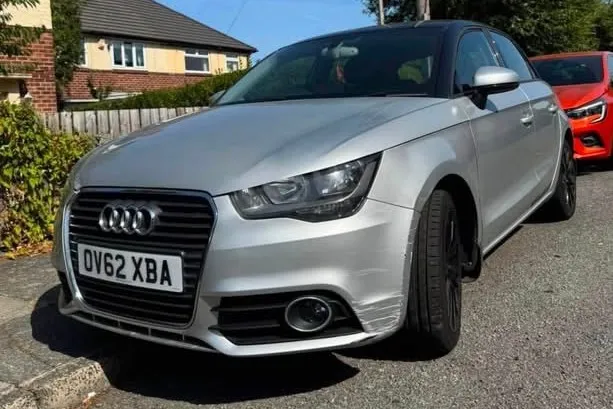 Silver Audi A1 Sportback with black roof, front three-quarter view